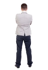 back view of Business man  looks.  Rear view people collection.  backside view of person.  Isolated over white background. The guy put his hands on his chest.