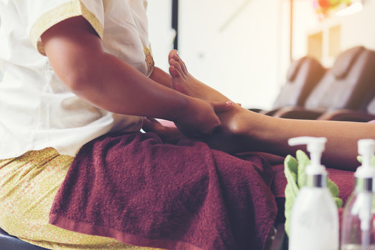 Thai foot massage alternative medicine therapy with Thai herb ar