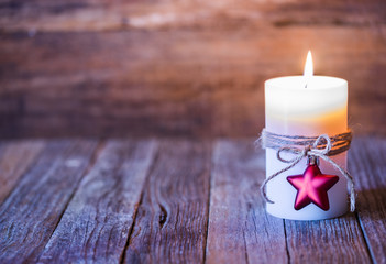 Christmas background with burning candle