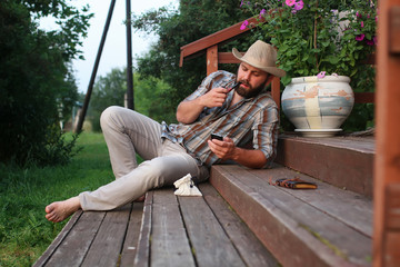 Fototapeta premium man smoke pipe outdoor