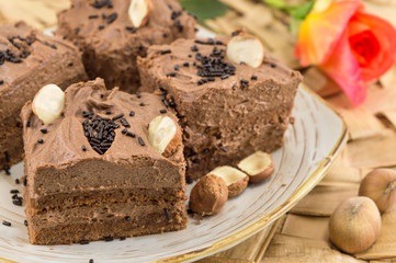Hazelnut cake covered with chocolate cream