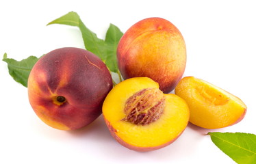 Fresh raw peaches on white