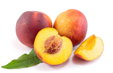 Fresh raw peaches on white