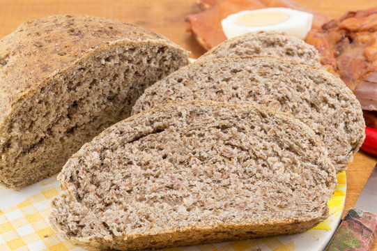Home baked brown bread slices on the table
