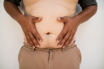 Naklejka premium the man open the belly fat