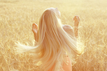 blonde with long hair in the summer happiness