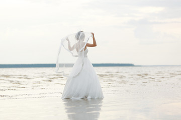 Fototapeta na wymiar white wedding dress the bride in the morning