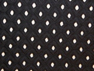  текстура черной ткани с дырками на белом фоне   