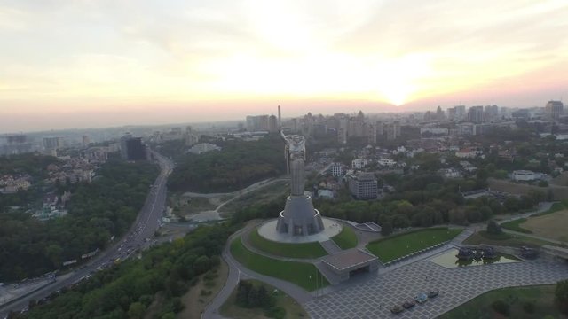 Panoramma of Kiev with the monument Motherland mother in the foreground. View of the left bank of the Dnieper River and the bridge Paton. Rodina-Mat. Aerial view 3840x2160 video 4k