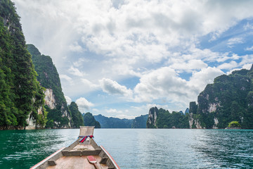 Wooden boat in Ratchaprapha dam, Surat Thani, Thailand.
