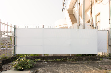 Large blank billboard on a street wall, banners with room to add your own text