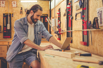 Handsome carpenter working
