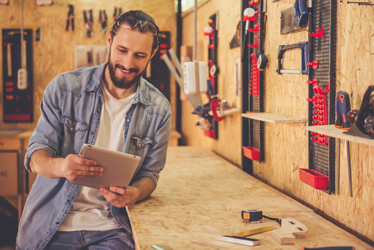 Handsome carpenter working