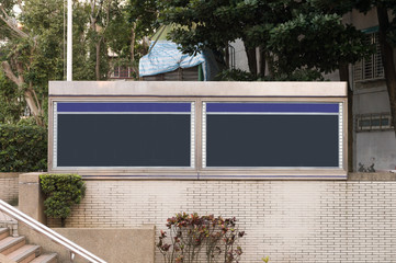 Large blank billboard on a street wall, banners with room to add your own text