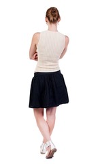 Naklejka premium back view of standing young blonde woman. Rear view people collection. backside view of person. Isolated over white background.