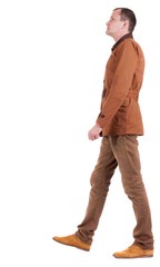 Back view of going  stylishly dressed man in a brown jacket.  walking young guy. Rear view people collection.  backside view of person.  Isolated over white background.