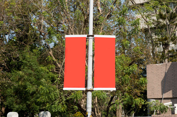 Large blank billboard on a street wall, banners with room to add your own text