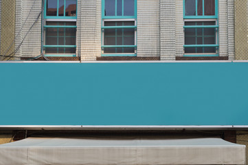 Large blank billboard on a street wall, banners with room to add your own text