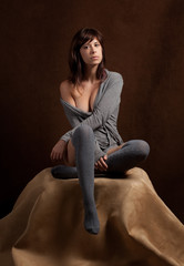 Seated Woman in Sweater and Knee Socks