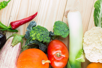 fresh farm vegetables on wooden table, top view