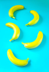 Fresh bananas on vibrant blue background