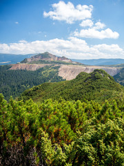 Fototapeta na wymiar landscape view over a sulfur surface mine near calimani mountains romania 