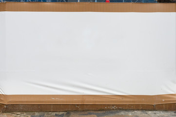 Large blank billboard on a street wall, banners with room to add your own text