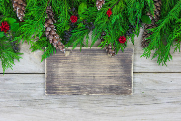 Blank wood sign with holiday garland border