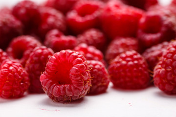 Fresh raspberry is on a white background.