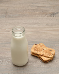 Milk in a bottle and cookies