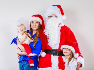 Happy family together with Santa Claus.