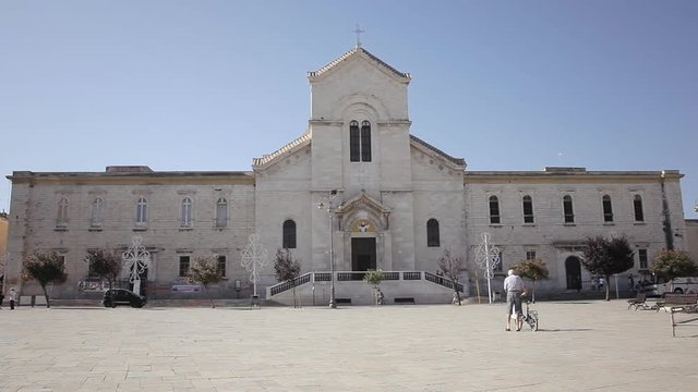 Giovinazzo, Italy: the church of San Domenico. Italian romanic style. Long shot. Archival, context, establishing.