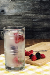 Sparkling lemonade water with strawberries, blueberries, blackberries and raspberries 