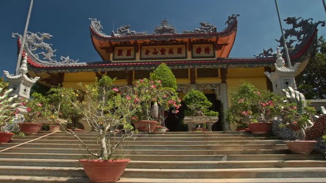 Close Motion up Steps to Buddha Pagoda among Flowers