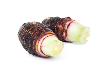 closeup of taro root on white background,raw material for cooking concept