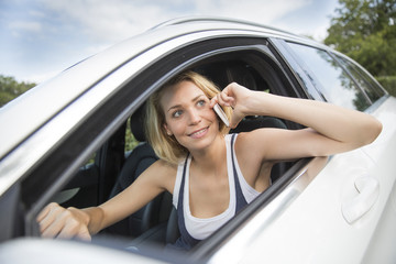 Woman, talking on phone while driving