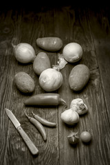 A B&W of an assortment of vegetables commonly used in cooking.