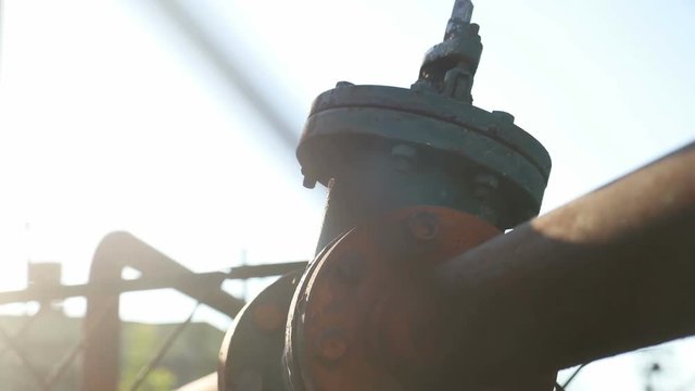 old gas pipe valve sunlight video industrial outdoor