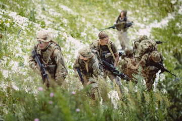 Special forces soldiers with weapon take part in military maneuv