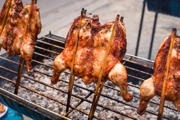 Hot roasting chicken on grill, thai street food