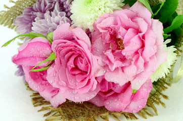 Flowers bouquet with pink roses and chrisanthemum.