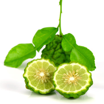 Fresh Fruits and Green Leaves of Kiffir lime or Leech lime on White background.