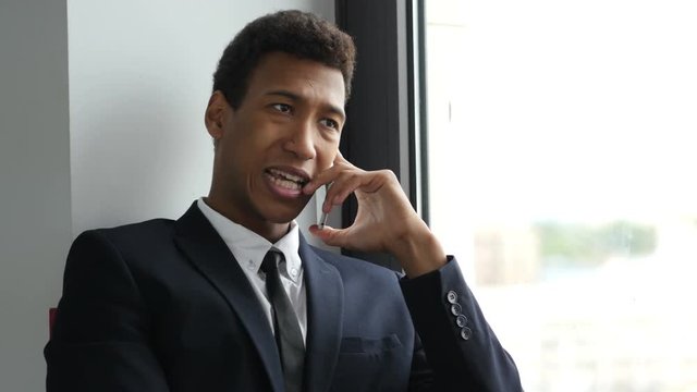 Businessman in Suit Talking on Phone, Busy Negotiating