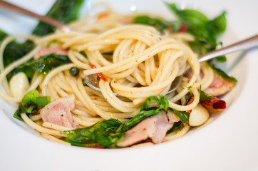 The spaghetti mixed with stir-fried spicy fish. Aromatic spices taste