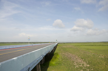 Motion of traffic road on Thalesap Songkhla Bridge(Ekachai bridge) or Thanon Chaloem Phra Kiat 80 Phansa Road on July 14, 2016 in Phatthalung, Thailand.