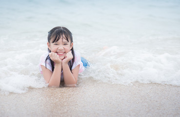 Asian girl ying on the breach