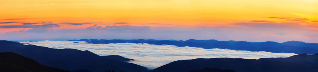 Fototapeta na wymiar Picturesque sunrise morning in mountains above clouds, Carpathia