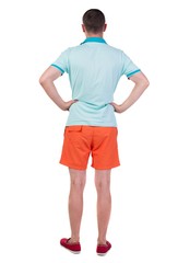 Back view of young manin shorts looking.  Rear view people collection.  backside view of person.  Isolated over white background.