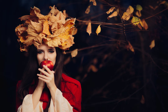 Woman With Autumn Leaves Crown Eating An Apple