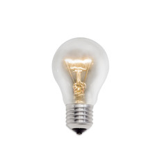 Glowing incandescent lamp on a light background